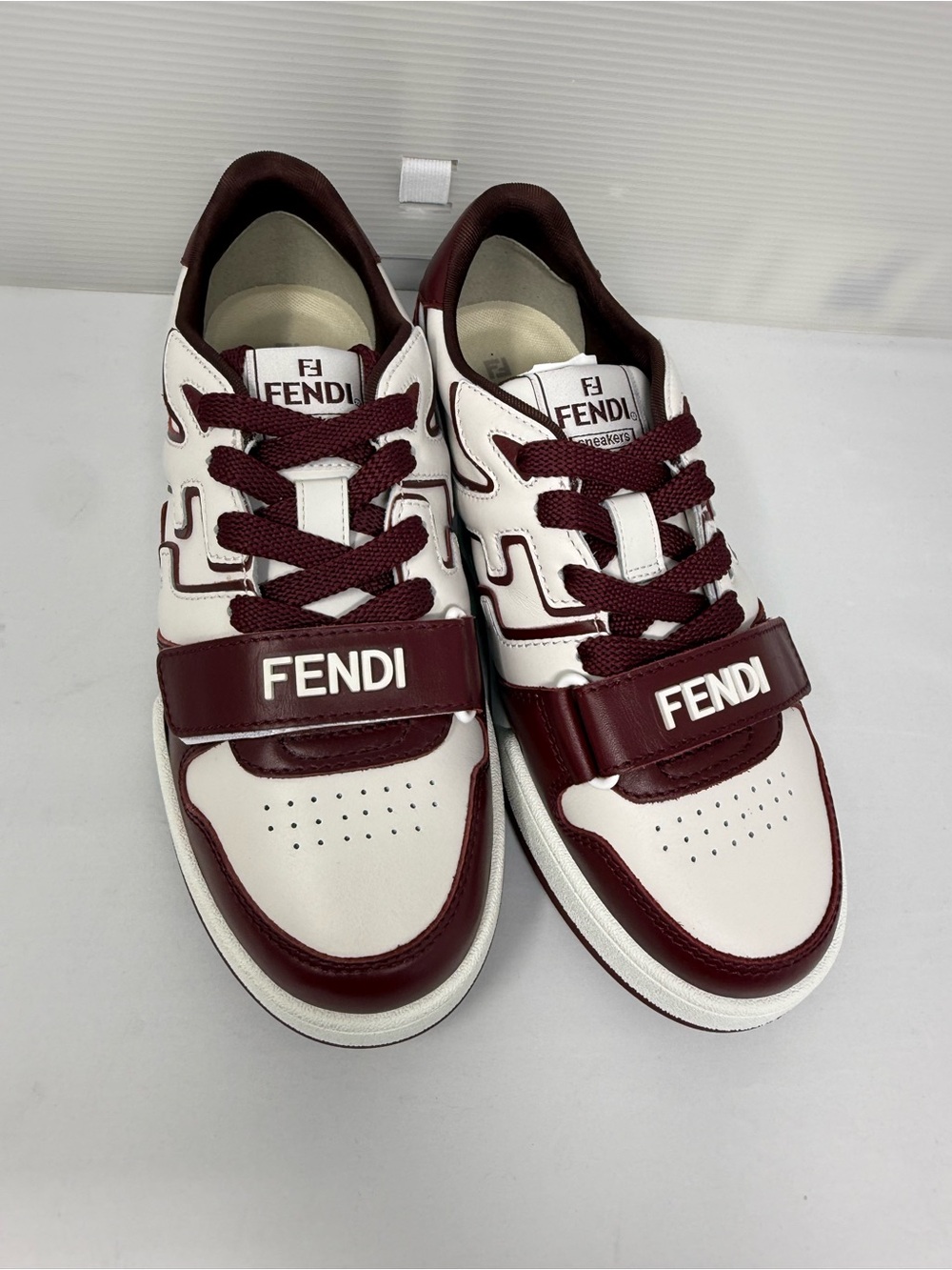 Fendi women’s White & Burgundy Leather Strap Sneakers